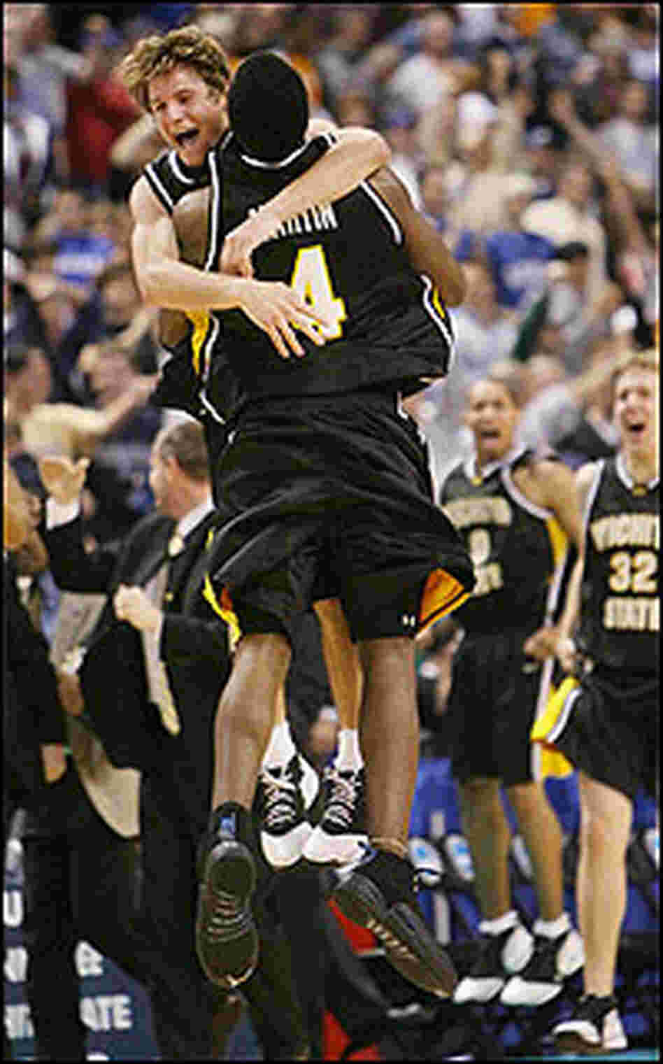 Wichita State University's Matt Braeuer (L) and Ryan Martin celebrate.