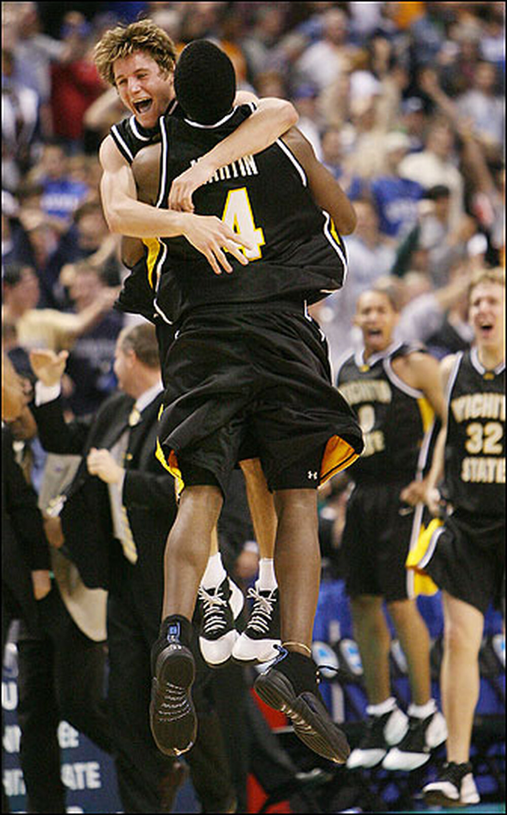 Wichita State University's Matt Braeuer (L) and Ryan Martin celebrate.