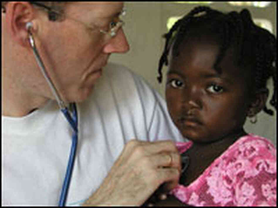 Dr. Paul Farmer with a young patient.