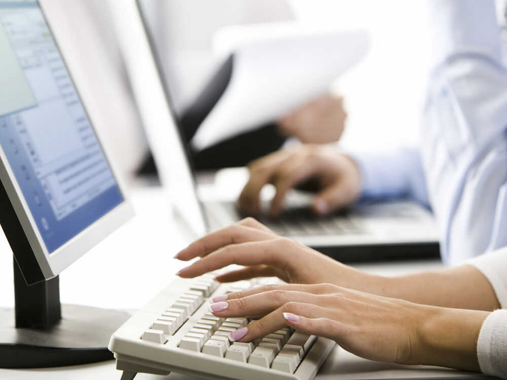 Hands on a computer keyboard
