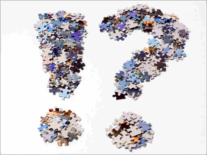 Exclaimation point and question mark made out of puzzle pieces