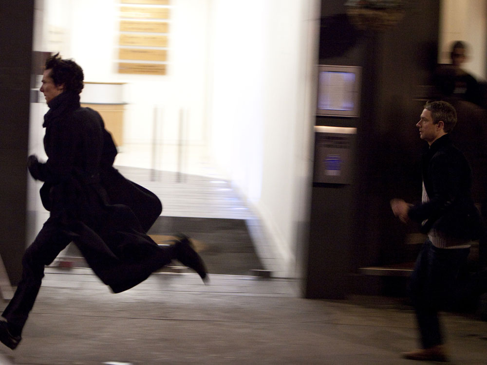 Sherlock Holmes (Benedict Cumberbatch, left) and Dr. Watson (Martin Freeman) race through the streets of London in a gritty new adaptation of the classic detective stories.