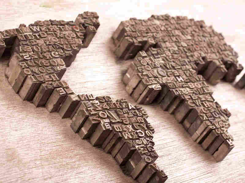Map of the Earth made of lettered stamps