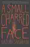 A Small Charred Face