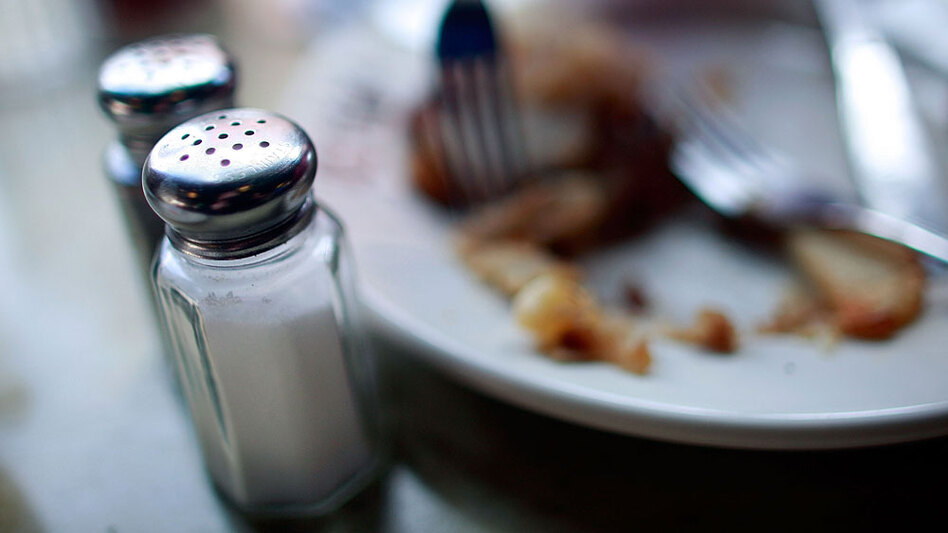 Eat salt and saturated fat sparingly. (Mario Tama/Getty Images)
