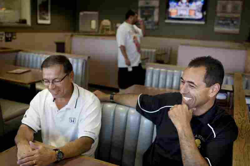 Visger shares high school football stories with his friend and former Stagg High teammate Alex Zanini.