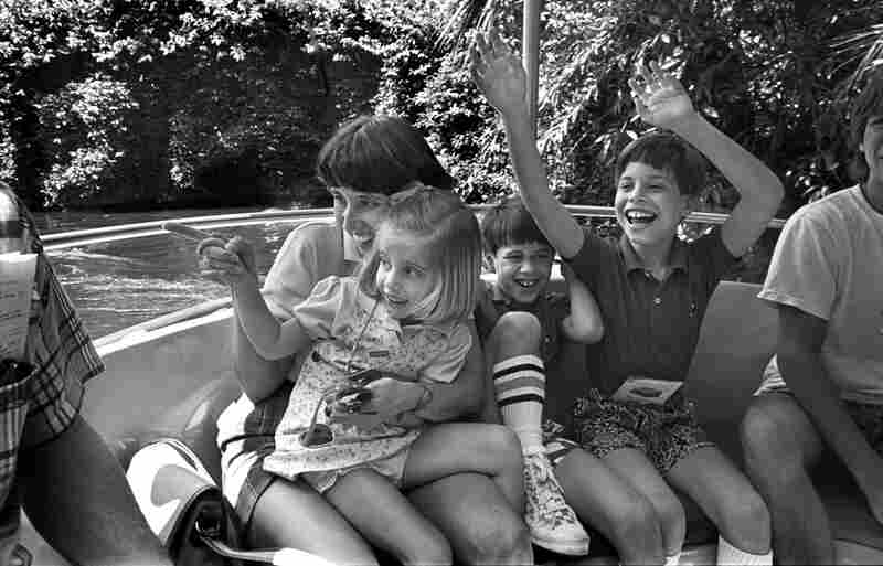 The family rides the Jungle Cruise at Disney World. John suggests it would be a good summer job for David someday. April 1987.