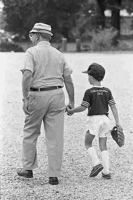 Morgan holds hands with his grandfather and "best friend," Elmer Morgan. August 1986.