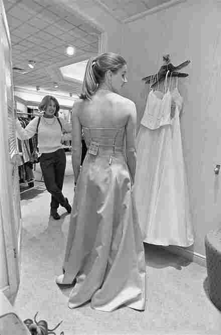 Sara finds her prom dress in one day of shopping with her mother. She also buys another formal dress in case she needs it for dances in college. March 2001.