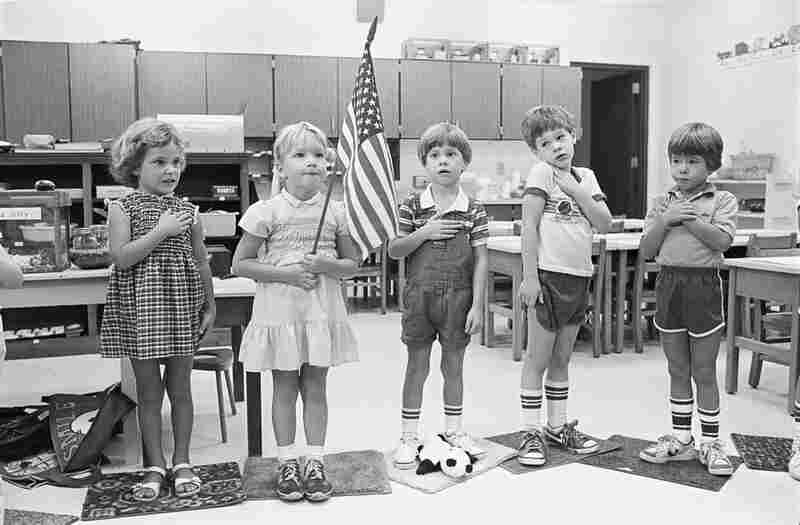 David McGarvey (center) recites the Pledge of Allegiance for the first time in kindergarten. Three of his classmates in the picture will stay with him through eighth grade. September 1982.