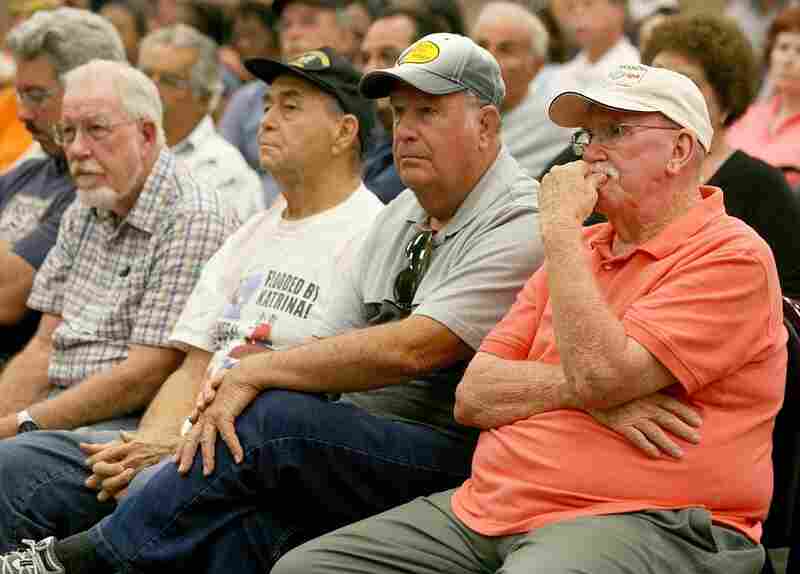 Residents listen to a discussion with parish officials and a BP representative on May 25 in Chalmette, La. Officials now say that it may be impossible to clean the hundreds of miles of coastal wetlands affected by the massive oil spill.  