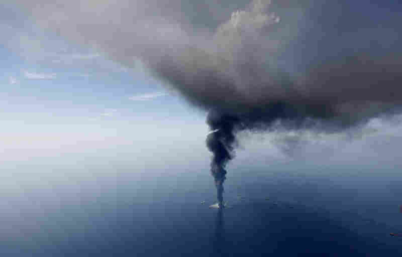 In this aerial photo taken April 21 more than 50 miles southeast of Venice, La., the Deepwater Horizon oil rig burns. 