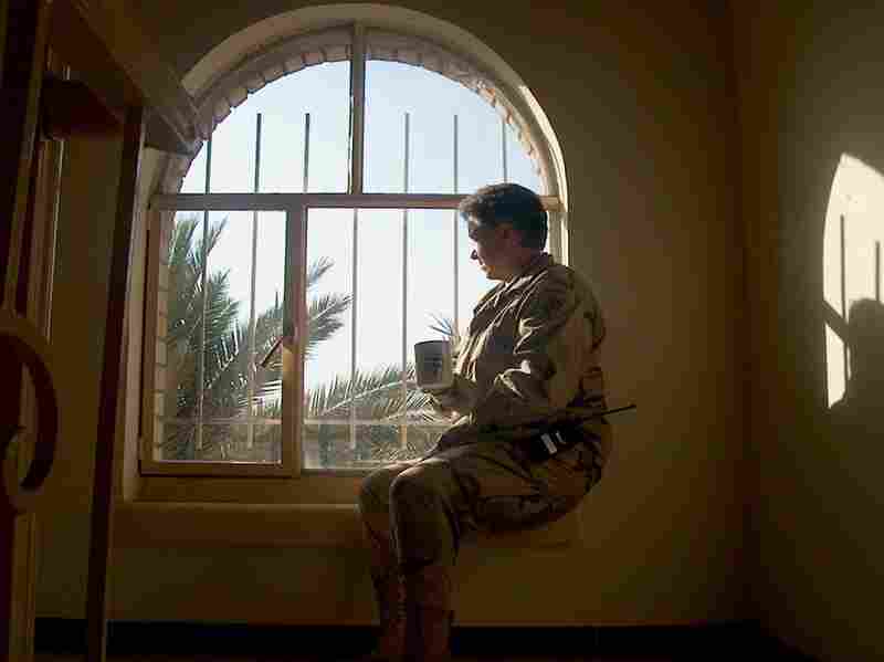 In 2008, after Dyarman retired from the Army, Department of Veterans Affairs doctors linked her cognitive problems to her head traumas. Here, Dyarman drinks a cup of tea while serving in Iraq in August 2005. 