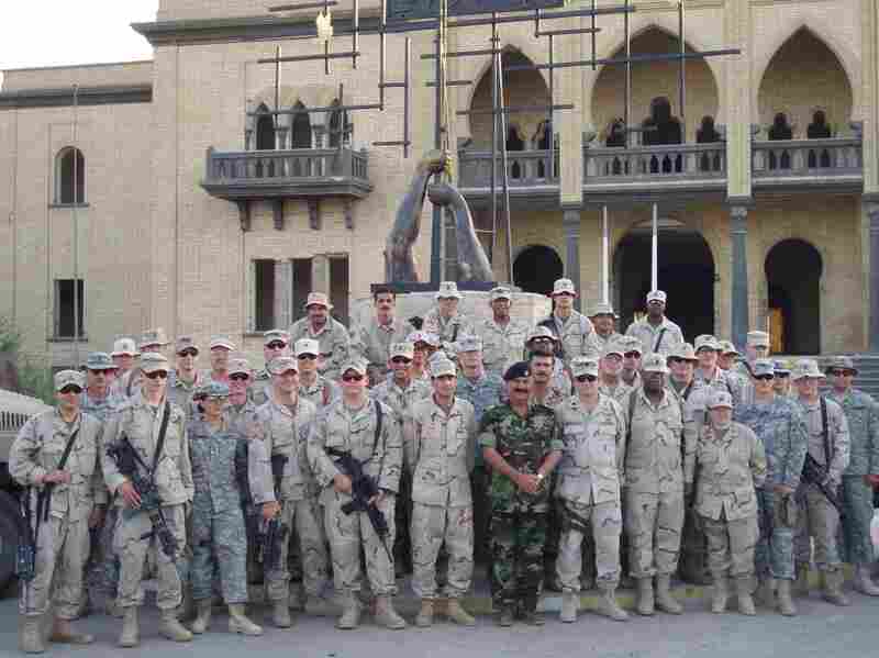 Dyarman (first row, right) is seen with other U.S. soldiers and an Iraqi general at Tiger Base on Sept. 11, 2005. "I served my country. Now what's my country doing for me?" she asks. 