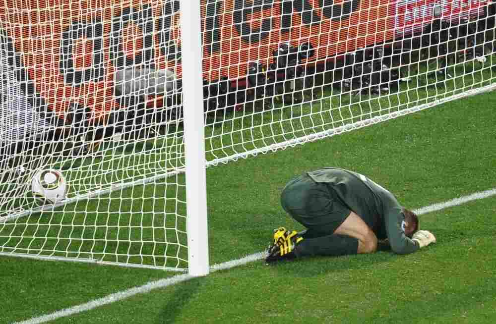 England's goalkeeper Robert Green reacts