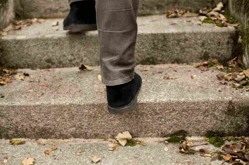 A man walks up stairs.
