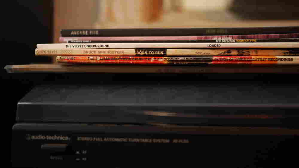 LPs on top of a dusty turntable