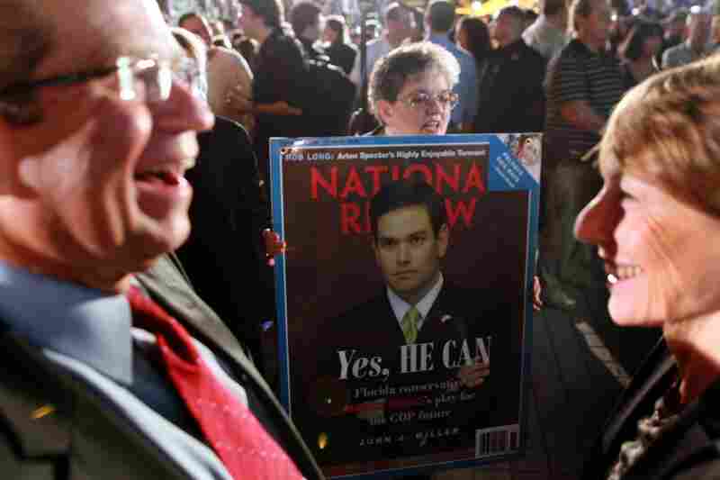 A supporter of Florida Republican Marco Rubio waits for him to arrive for his "Reclaim America Victory Celebration" in Coral Gables, Fla. 