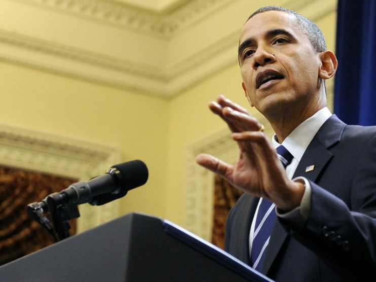President Obama announces a tentative deal with Republicans to extend tax cuts and jobless benefits Monday night. (Getty Images)