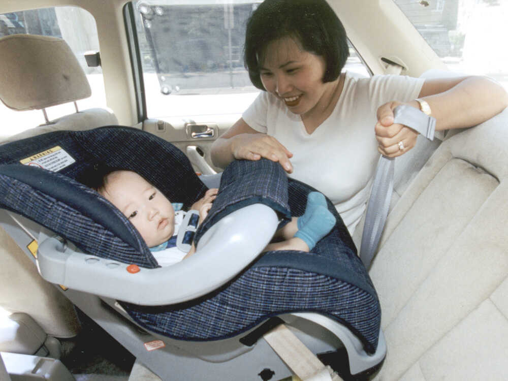 How long should a baby outlet face backwards in a car