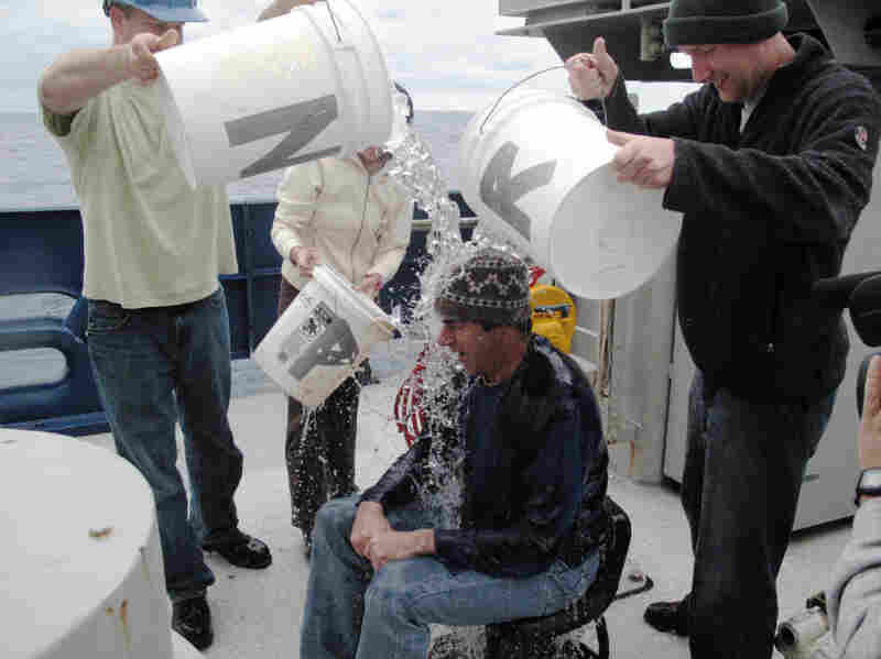 Back on the Atlantis after his first trip in the Alvin, NPR's Richard Harris is greeted with an ice-water bath.