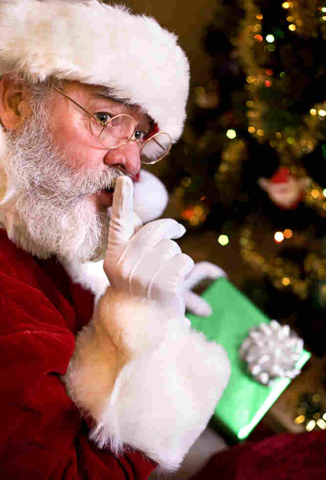 Santa Claus signals to shush