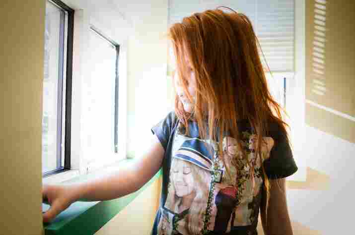 Katie Dail, 6, plays in the waiting room of the Mt. Washington Pediatric Hospital in Baltimore on Dec. 21. Katie, who has autism, has a dangerously high level of lead in her blood.