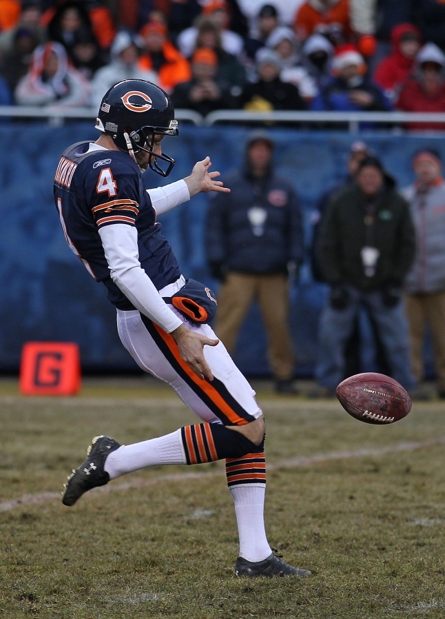 Brad Maynard of the Chicago Bears punts  the ball against the New York Jets on Dec. 26 at Soldier Field in Chicago. The authors of <em>Scorecasting </em>say statistics show that running a play on fourth down instead of punting can be more effective at getting points, contrary to common belief. (Jonathan Daniel/Getty Images Sport)
