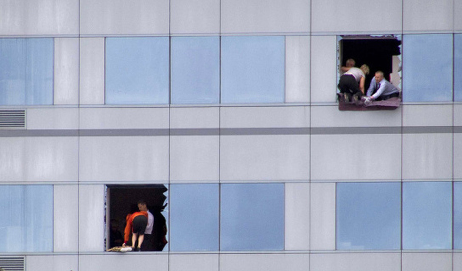 People trapped in a high-rise building in central Christchurch, New Zealand, broke windows as they waited to be rescued after a magnitude 6.3 earthquake struck the city at the height of a busy workday Tuesday. (AP)