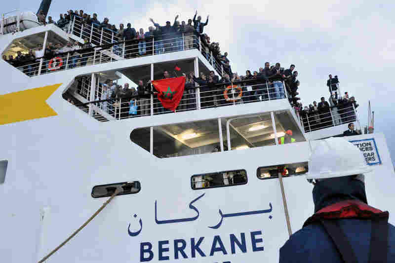 Moroccan expatriates arrive Sunday in the northern Moroccan port of Tangiers on a boat from the rebel-held city of Benghazi, Libya. Some 4,000 expats were repatriated by Moroccan authorities. 