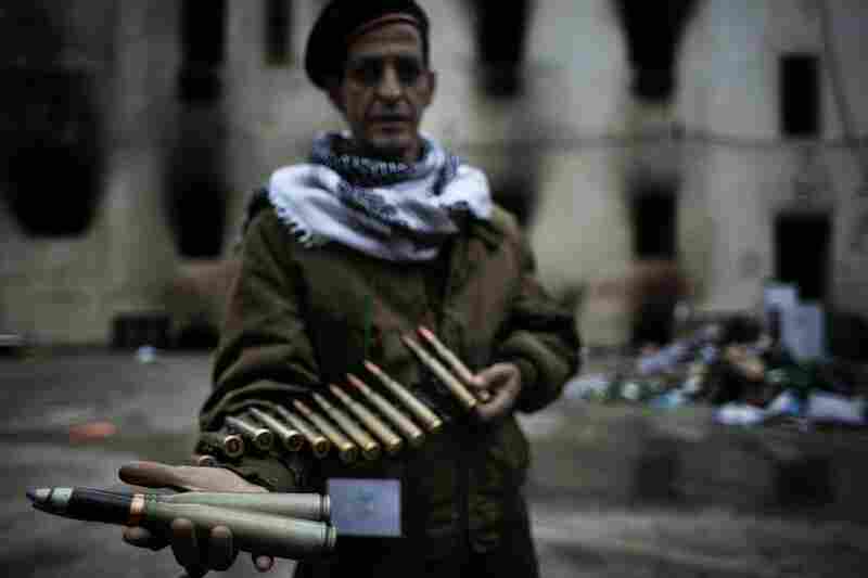 A Libyan insurgent soldier displays heavy-caliber ammunition, allegedly intended to be used against civilians in Benghazi on Sunday. 