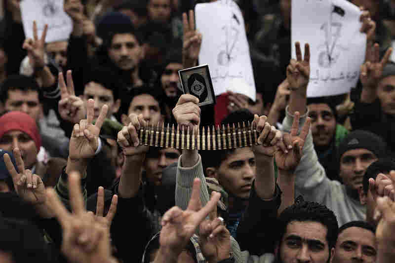 Libyan rebels gather for prayer on March 4. Loyalist forces have launched a fresh air strike on opposition territory in the east, while pumped-up opposition fighters pushed forward the frontline against Moammar Gadhafi's regime. 