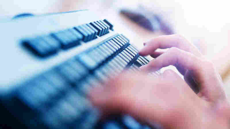 Fingers fly over a keyboard.