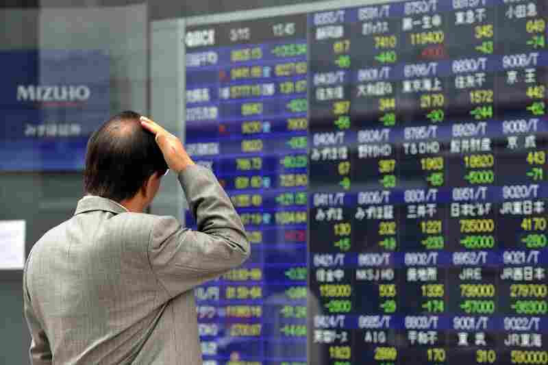 A stock price board in Tokyo reflects the market's plunge. 