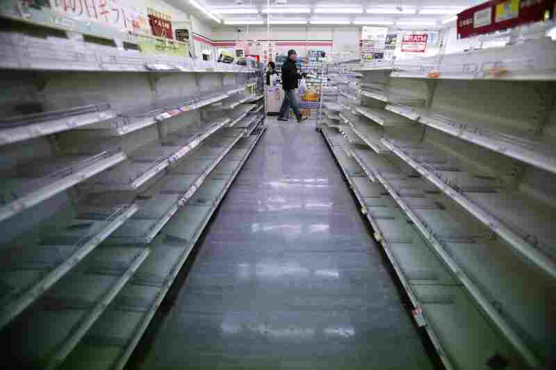 The shelves of a convenience store are empty in Ofunato, Iwate prefecture, northern Japan. 