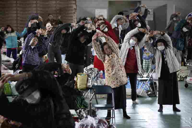 Evacuees exercise at a makeshift shelter in Minamisanriku, northern Japan. 