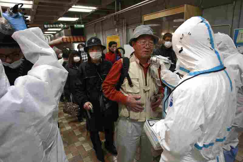 An evacuee is screened for radiation exposure at a testing center in Koriyama city, Fukushima prefecture. 