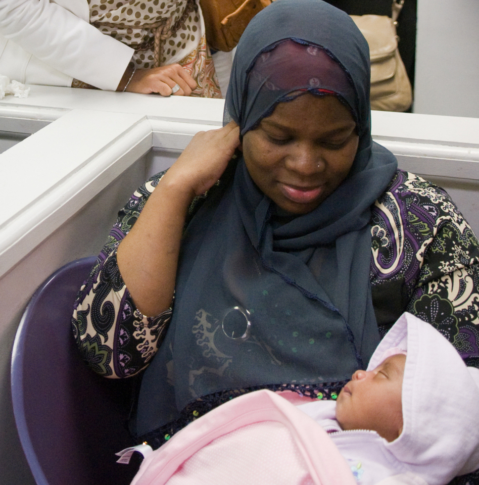 A mother and daughter at the Unity Health Care's Upper Cardozo clinic in Washington, D.C. at a celebrity event in 2009. The clinic relies on some funding from the Title X Family Planning Program. (Kris Connor/Getty Images)
