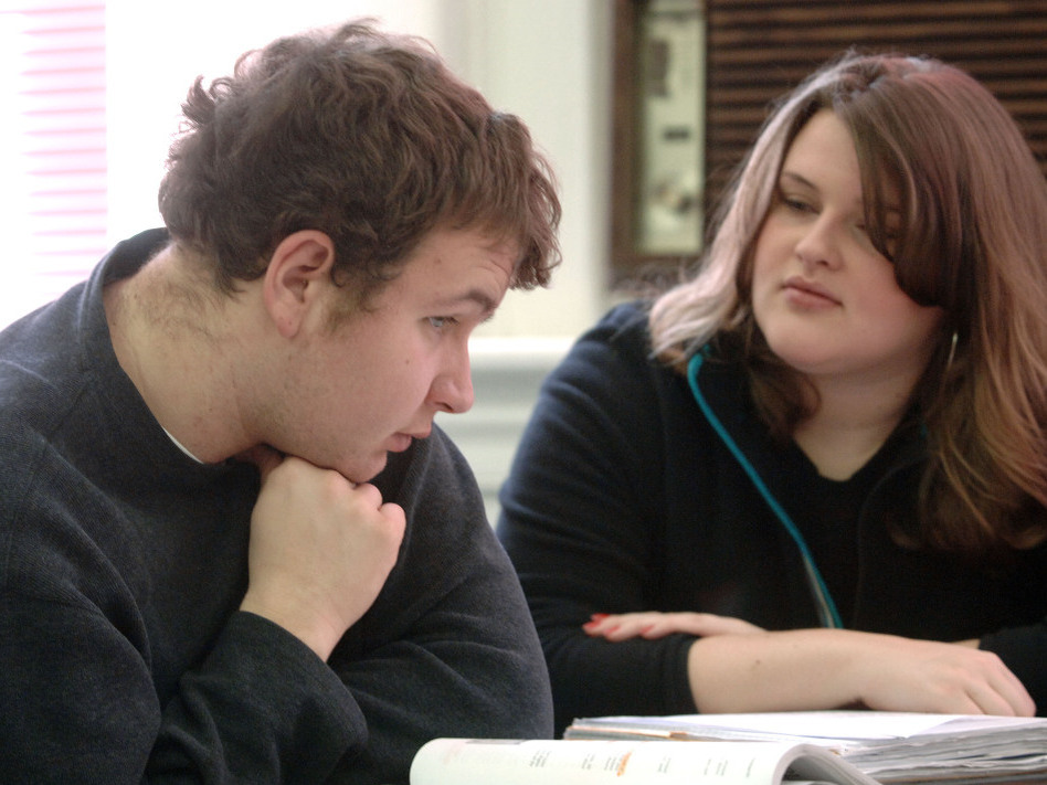 Lowell Austin, an autistic student at Marshall University in Huntington, W.Va., receives tutoring from Stephanie Hurly at the university's Autism Training Center, one of several college programs highlighted on the website <a href="http://collegeautismspectrum.com/index.html">College Autism Spectrum</a>. (Jeff Gentner/AP)