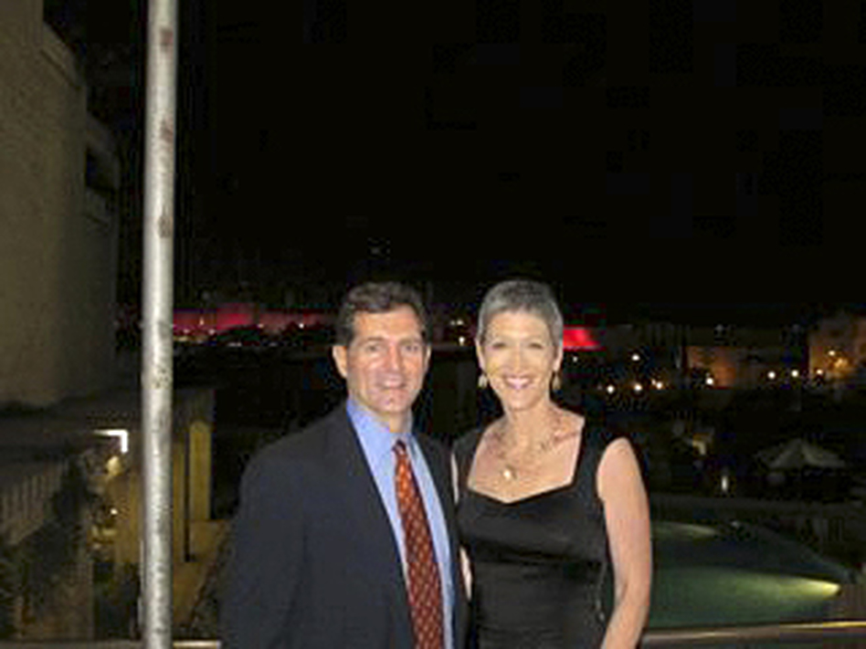 Greg Myre and Jennifer Griffin returned to Jerusalem last October, for a Race For The Cure breast cancer event. The walls of Jerusalem's Old City are in the far background, lit by pink lights for the occasion. (Greg Myre and Jennifer Griffin)