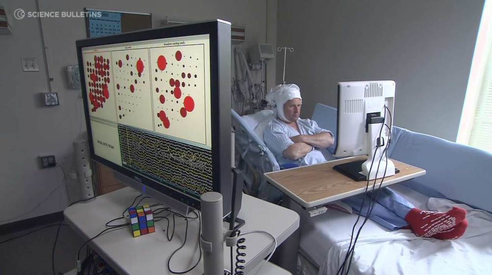 A patient participates in a brain-computer interface study. By placing an array of sensors directly on the brain and connecting them to a computer, researchers are able to decode brain signals into meaningful information, including some words. (American Museum of Natural History Science Bulletins)