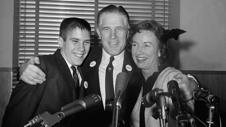 George Romney with his wife, Lenore, and teenage son Mitt, after announcing he would seek the Republican nomination for governor of Michigan at a press conference in 1962. (AP)