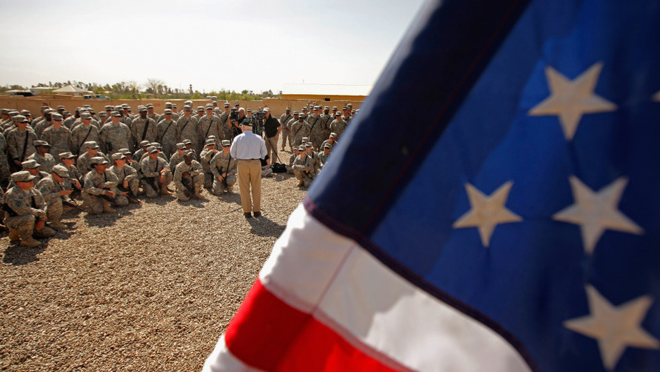 Defense Secretary Robert Gates talks with troops during a visit April 7 at Camp Victory in Baghdad. (Chip Somodevilla/Getty Images)