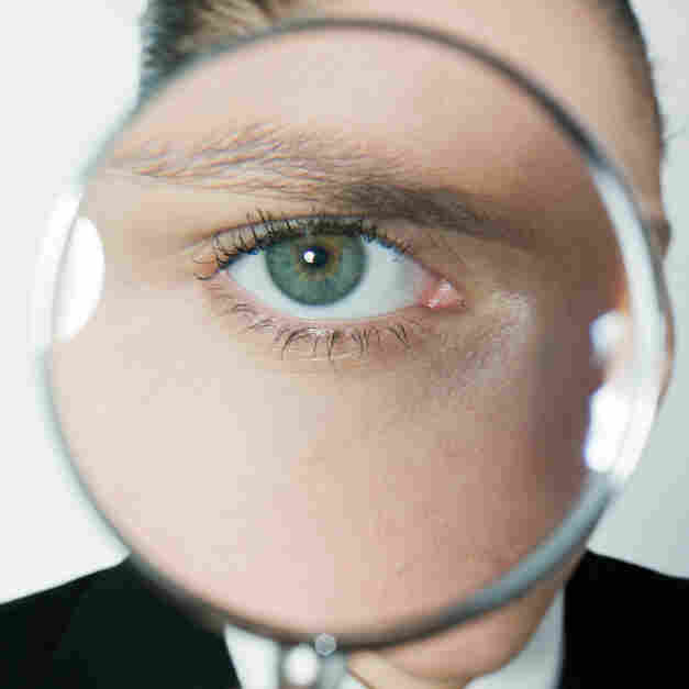 Eye in a magnifying glass