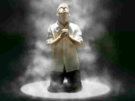 Male looks up in prayer.
