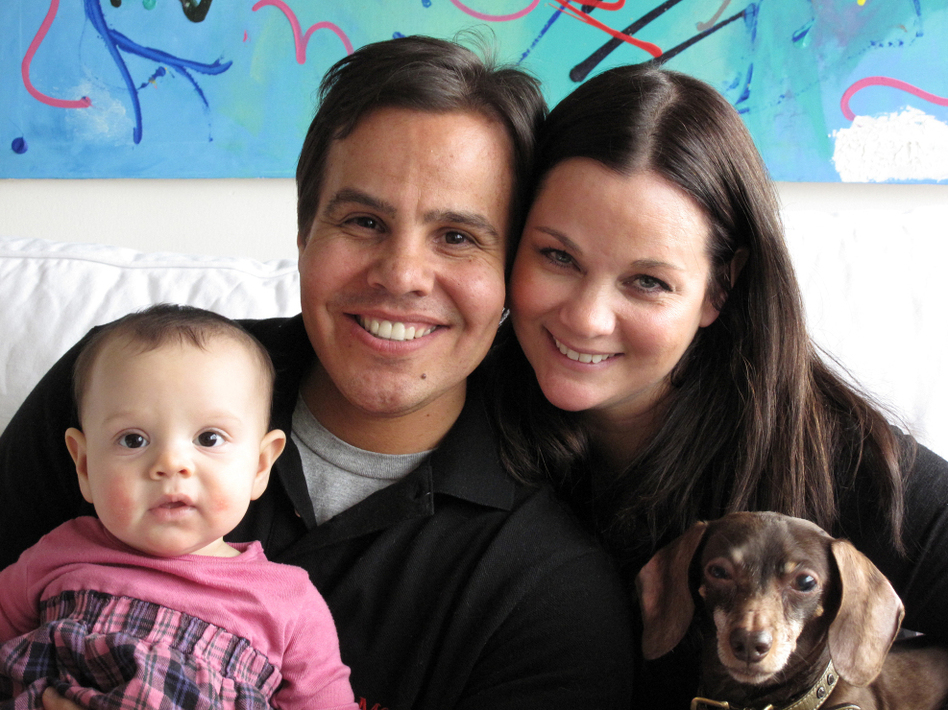 Robyn Ross and Mark Cohen with their baby, Camden, who's here thanks to eggs Robyn froze several years ago when she was single. (Marisa Penaloza/NPR)
