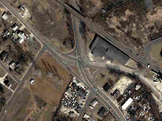 An aerial photograph shows the Rozzelles Ferry Road and W. Trade Street intersection, before it was improved.