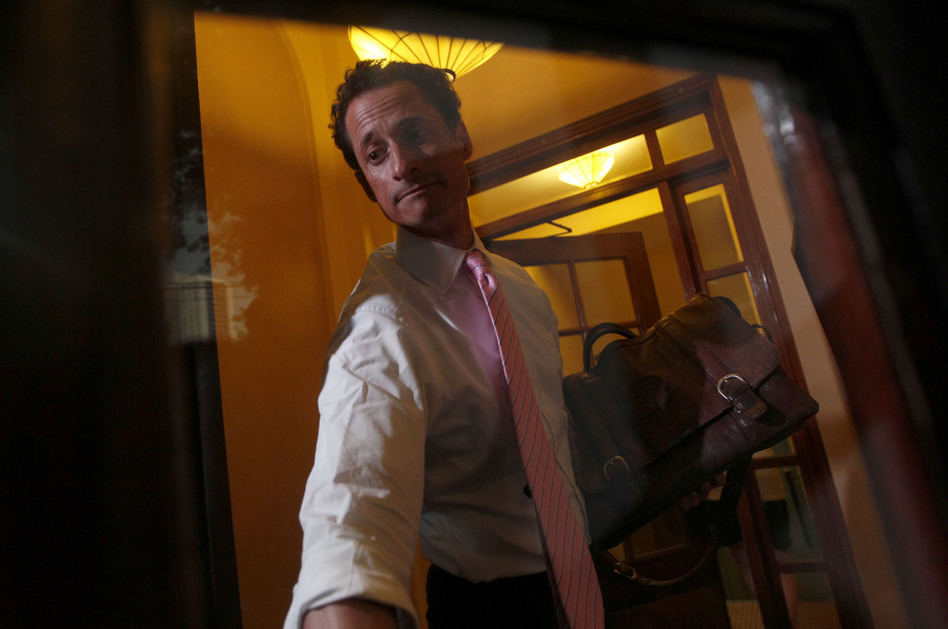 Democratic Rep. Anthony Weiner closes the front door of his building when arriving home in New York, on Thursday. (Mary Altaffer/AP)