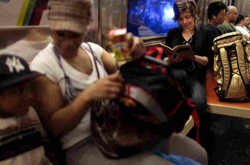 Chase studies a Stravinsky score on her subway trip to Manhattan. Next stop is an appointment with a flute technician on the Upper West Side.