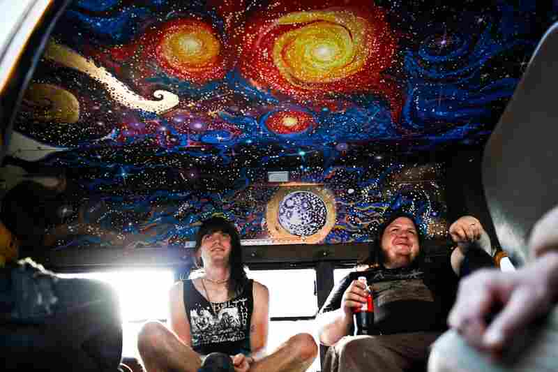 Guitarist Garrett Underwood (left) and drummer Joshy Brettell from the D.C. death-doom metal band Ilsa chill in their van before heading into St. Stephen's for their evening performance.